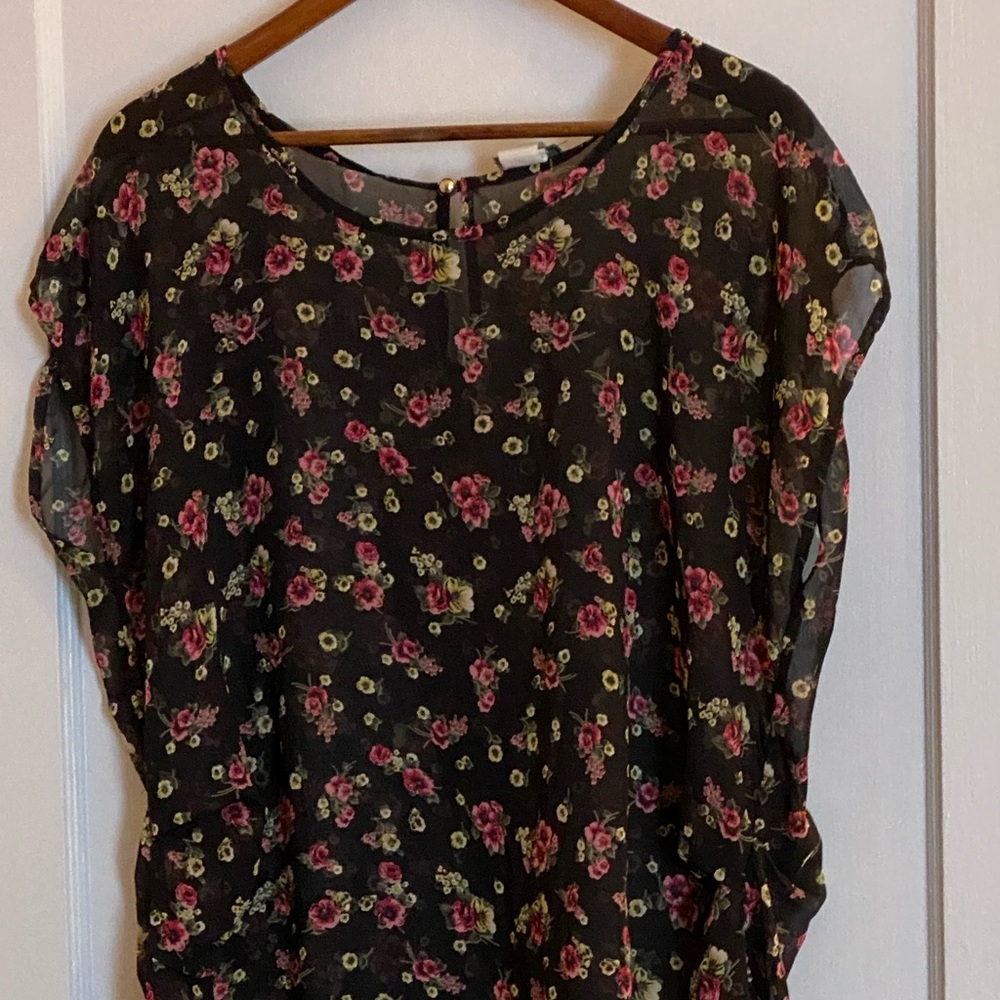 Shear sleeveless blouse black background with small pink and white roses.